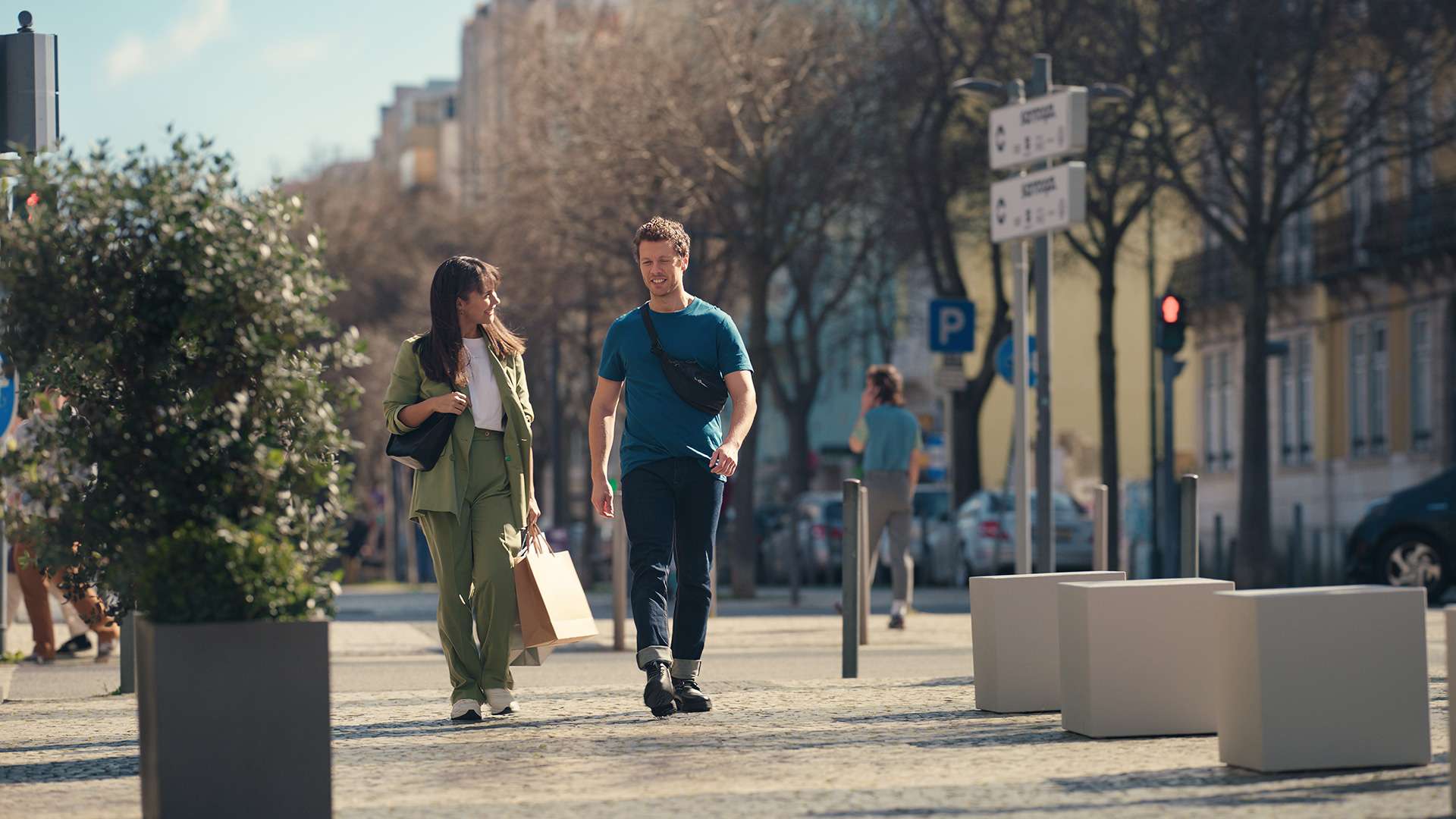 Man and woman walking down the street